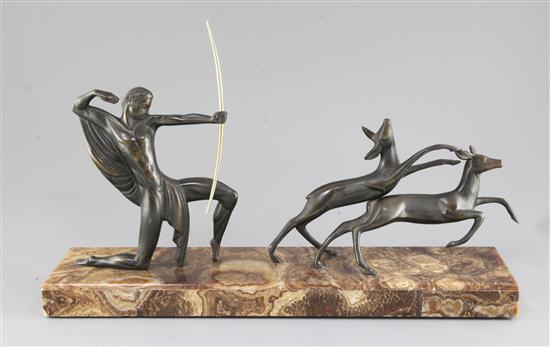 Michel Decoux. An Art Deco bronze group of an archer and two deer, width 19.5in. height 12in.